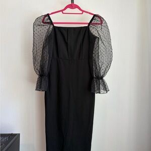 Elegant Black Dress with Sheer Polka Dot Sleeves